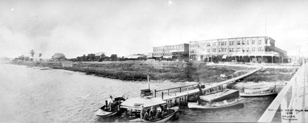Boat dock on Lake Worth with buildings in background - West Palm Beach, 1900; source: State Archives of Florida, Florida Memory